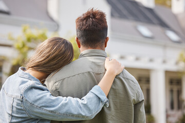 Couple hug outside new home from back, property or future investment opportunity for young people....