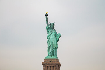Statue of Liberty on its Base From the Front in a Wide Shot with Sky in the Background © Bento