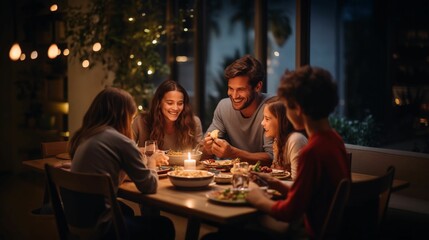 a family of four lights candles in the dinner table, and is seated at the