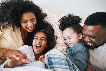 Mom, dad and children in bed with tickling, comic joke and laugh with bonding, care and love in family home. Black man, mother and daughter with smile, play game or crazy in bedroom, morning or house