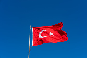 Turkish flag waving in the wind and blue sky