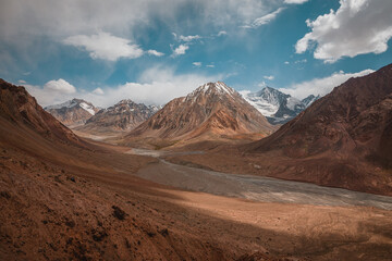Incredible sandy, territic mountains in the highlands of the Muzkol River in the Pamir mountain range in western Tajikistan.
