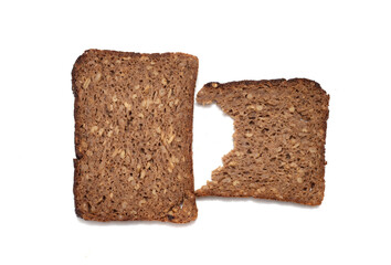 rectangular rye bread with seeds on a white background