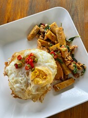Rice topped with stir-fried pork and basil, Rice topped with stir fried minced pork and basil with Fried egg
