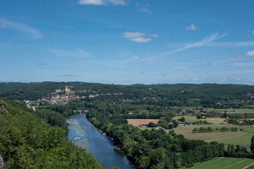 Fototapeta na wymiar Aerial landscape view on Dordogne river with the old bridge and beautiful fields near Domme village in France
