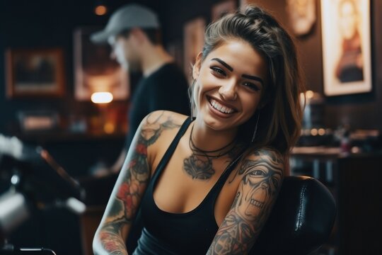 female model shows off tattoo in tattoo studio