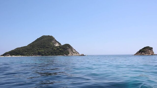 Marathonisi Turtle Island with Blue Ionian Sea in Zakynthos. Summer Vacation in Greece.