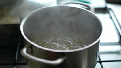 Close-up of boiling water inside large pan, preparing food