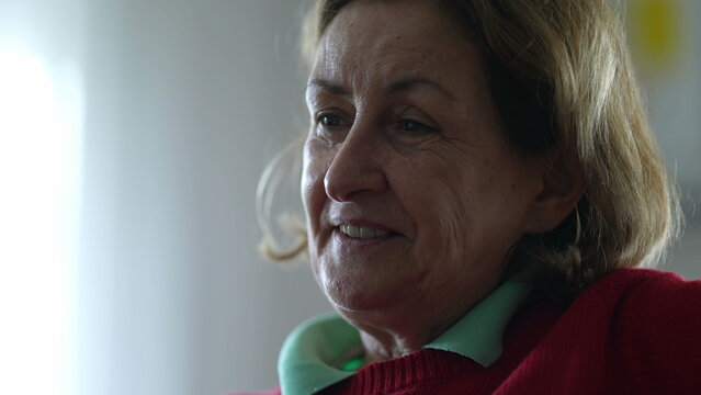 Close-Up/ Engrossed Elderly Caucasian Lady Actively Participating in Off-Camera Discussion