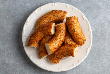 Turkish fast food bagel called Simit. Turkish bagel Simit with sesame. Bagel is traditional Turkish bakery food. Turkish name; simit - gevrek