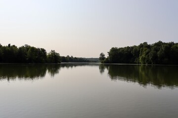 The peaceful lake in the countryside on a clear morning.