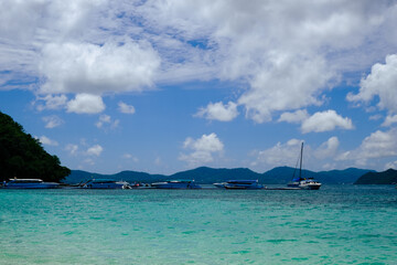long tail boat and blue water on tropical beach Phuket, Thailand