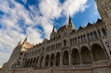 Fototapeta na wymiar Detailed view of picturesque Hungarian Parliament Building against colorful sky. One of the most beautiful buildings in Budapest. Travel and tourism concept