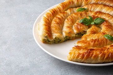 Spanakopita, greek phyllo pastry pie with spinach and feta cheese filling. Delicious handmade pies....