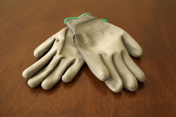 Close-Up of Cut-Resistant Gloves on Wooden Table