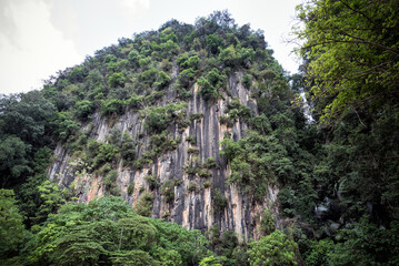 Scenic mountain around Tasik Cermin or Mirror Lake, Ipoh, Malaysia - Tasik Cermin, or Mirror Lake, is a stunning hidden lake surrounded by limestone karst towers.