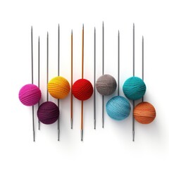 Colorful knitting needles and yarn balls isolated on white