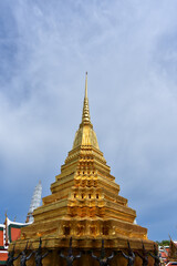 Fototapeta premium Prasat Phra Dhepbidorn or The Royal Pantheon at Wat Phra Kaew Temple, Grand Palace, Bangkok, Thailand - The Royal Pantheon is a mixture of Thai-Khmer style constructed by King Rama IV in 1856.