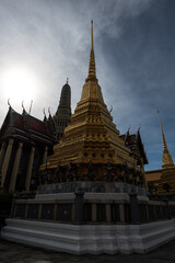 Fototapeta premium Wat Phra Kaew or Emerald Buddha Temple against sunlight in Grand Place, Bangkok, Thailand - Wat Phra Kaew or Emerald Buddha Temple a tourist landmark in Bangkok Thailand