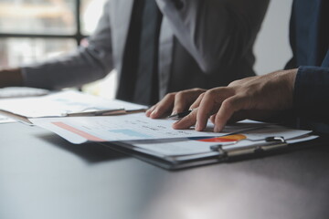 Financial Business woman analyze the graph of the company's performance to create profits and growth, Market research reports and income statistics, data,repotr,Financial and Accounting concept.