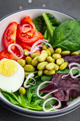 fresh salad edamame bean vegetable tomato, boiled egg meal food snack on the table copy space food background rustic top view  diet vegetarian vegan  