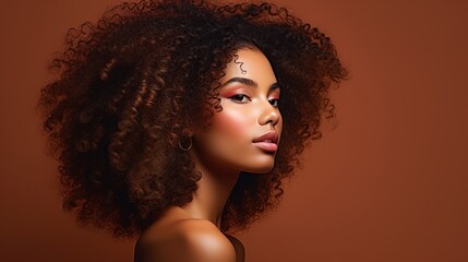 beauty portrait of an African American woman with clean, healthy skin. Girl with lovely afro hairstyle. Black curly hair