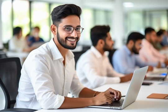 Young man or corporate employee using laptop at office