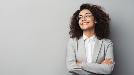 Happy youthful confident professional business woman, pretty trendy female executive looking at camera, standing arms crossed on gray background - obrazy, fototapety, plakaty