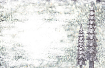 Christmas New Year background. Golden sparkling Christmas trees on a silver sparkling background
