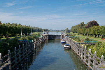 Fototapeta na wymiar The Wilhelminasluis is a lock in the river Afgedamde Maas near the Dutch village of Andel in the province of North Brabant. The lock was built around the year 1896