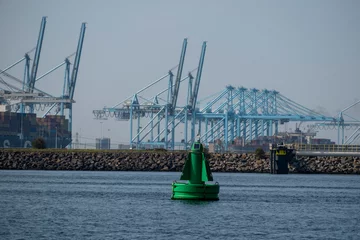 Deurstickers ROTTERDAM, NETHERLANDS - Maasvlakte, Rotterdam, the Netherlands - Port Rotterdam Maasflakte shipping harbour industrial port © Tjeerd