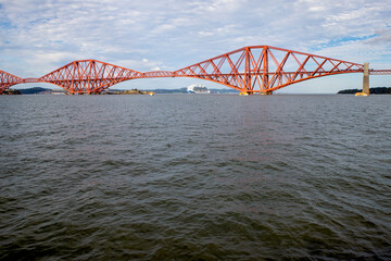 The Forth Bridge is a railway bridge across the Firth of Forth in Scotland. Is considered a symbol of Scotland, and is a UNESCO World Heritage Site. Designed by  Sir John Fowler and Sir Benjamin Baker