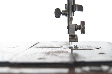 Sewing machine part close up on a white background