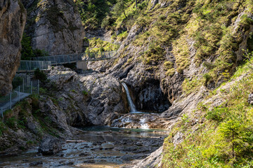 View over the small Stuiben Falls on a sunny day, reutte, Austria. Small waterfalls in beautiful nature.