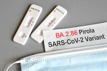 SARS‑CoV‑2 antigen test kit for self testing with positive result with text Pirola BA.2.86 on...