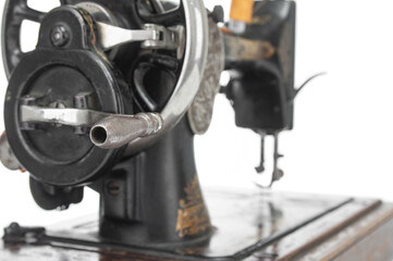 Fototapeta na wymiar Antique sewing machine close up on a white background