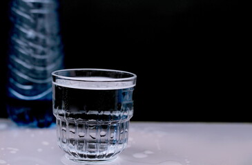 Glass of clear drinking water on a table top no people stock photo