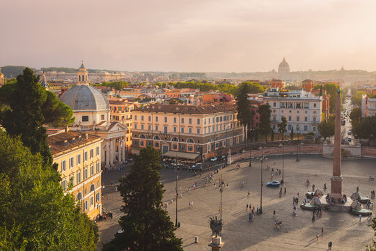 Golden sunset cityscape view from Terrazza del Pincio over the popular tourist landmark Piazza del Popolo with its Egyptian obelisk in the historic old town.