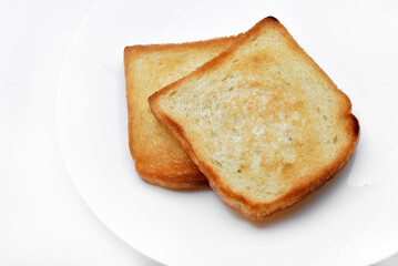 Fried toast on a white plate. Baked bread for sandwiches. Vegan food.
