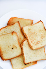 Fried toast on a white plate. Baked bread for sandwiches. Vegan food.