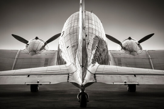 back view of an historical aircraft on a runway