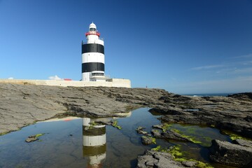 Hook head lighthouse, County Wexford, Ireland. Irish landmark from the 12th century in the sun.