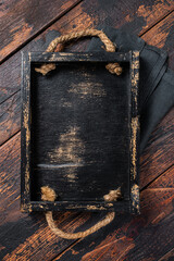 Directly Above view Of wooden tray on dark Table. Wooden background. Top view. Copy space