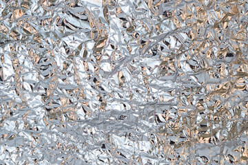 Background of crumpled grey metal foil