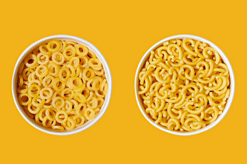 Macaroni noodle in  bowl on yellow pastel background