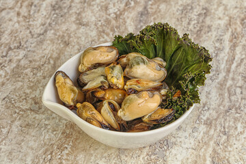 Tasty marinated mussels in the bowl
