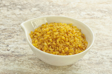 Raw bulgur in the bowl