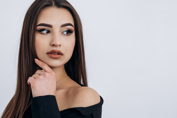 Fashion portrait of young pretty indian latin american woman posing in photo studio on white...