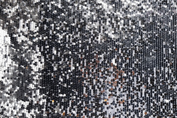 Fototapeta premium Festive gray background of sequins.