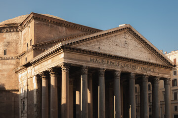 Close-up architectural detail with dramatic light and shadow of the ancient Roman temple, the Pantheon in the historic old town of central Rome, Italy.